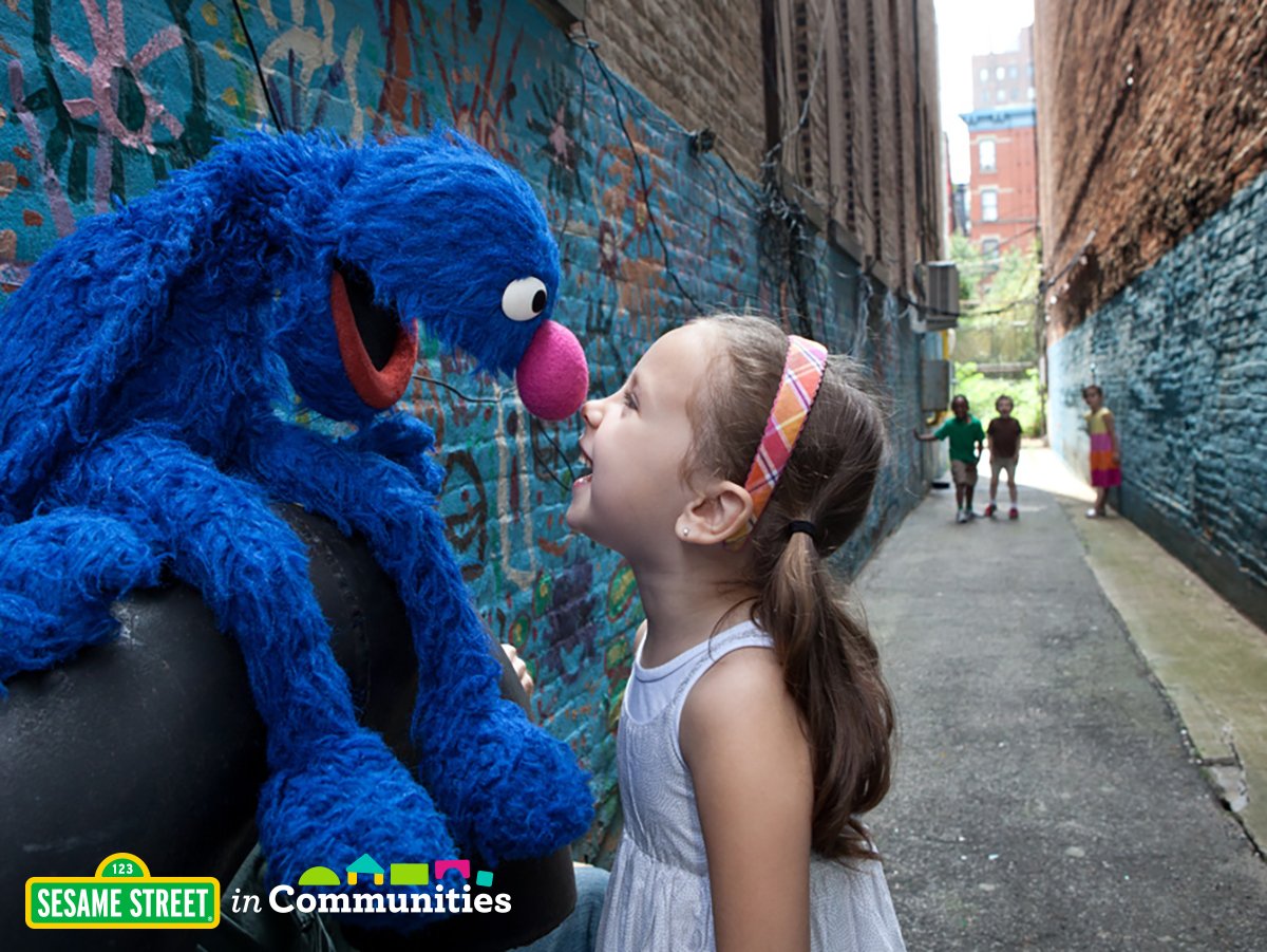 Grover plays with young girl