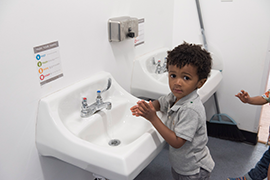 child  washing hands