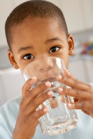 Boy drinking glass of water