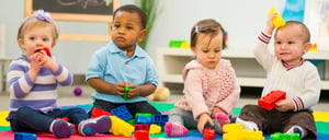 Diverse group of babies playing.