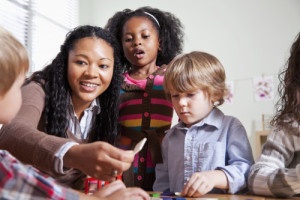 Preschool children in classroom with teacher