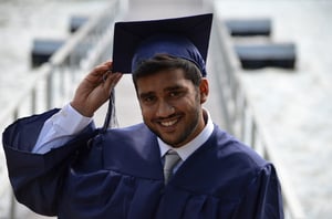 parent in college graduation cap and gown