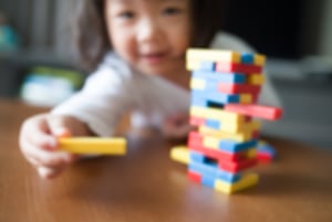 child playing jenga