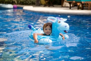 Child swimming in pool