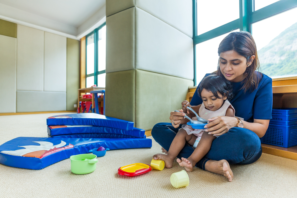 Indian mother play with her daughter at home-1