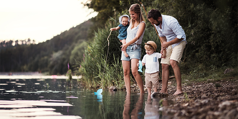 a-young-family-with-two-toddler-children-outdoors-EQWA8HM