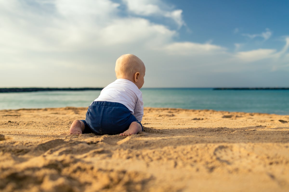 baby boy on  beach in summer