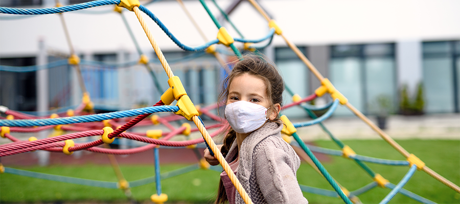 child wearing facemask outside