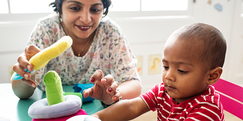 provider and child playing with toys