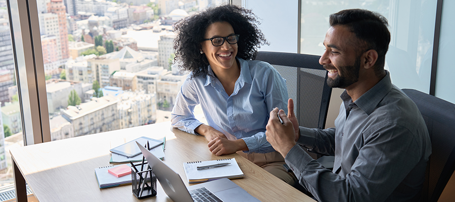 top-view-of-multiethnic-friendly-employees-sitting-4DC46QB