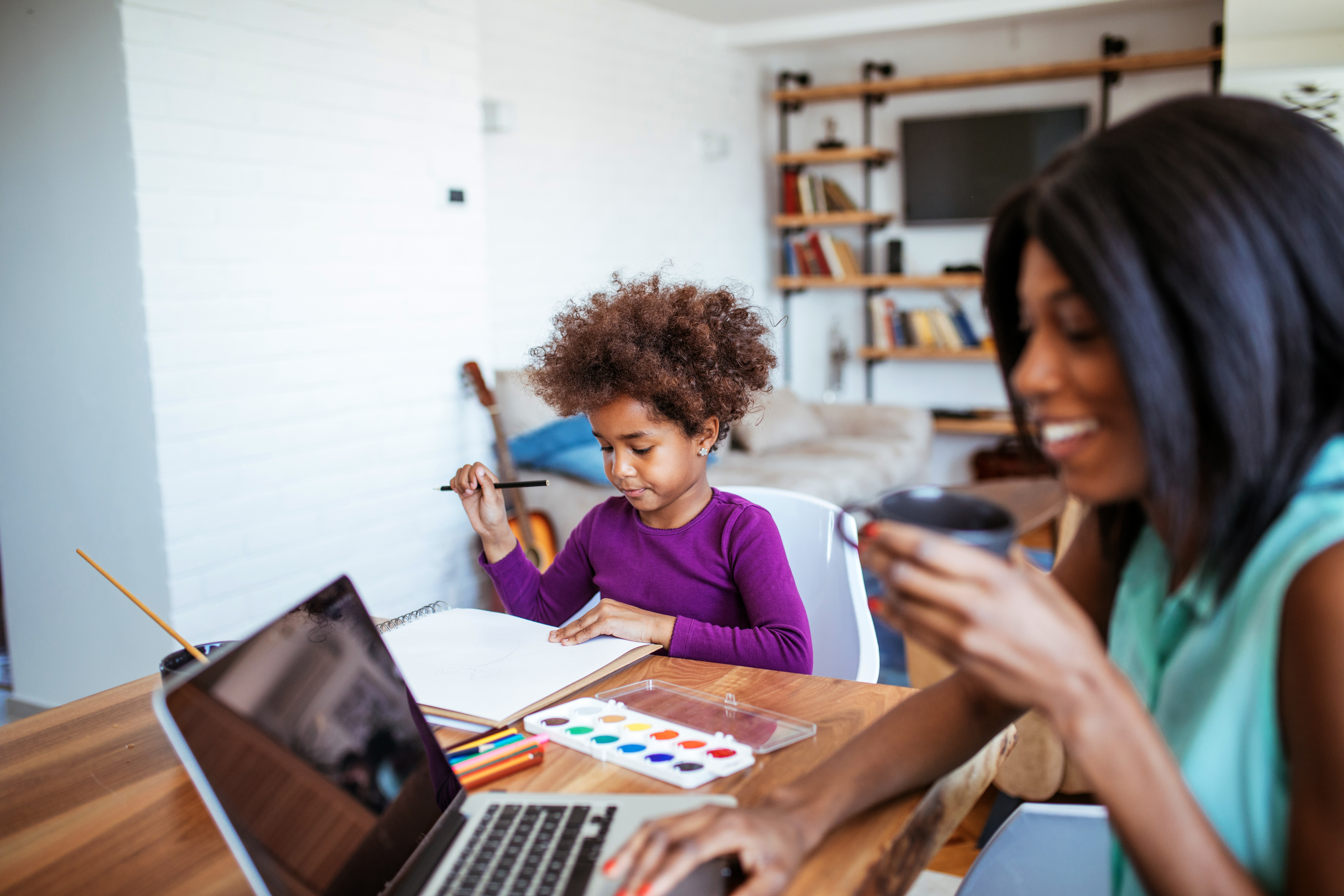 mom on call with representative and child out of school